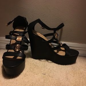 Black wedge heels with gold accents